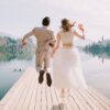 Happy Wedding, Honeymoon, Couple Jumping in The Lake